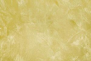 Texture of golden decorative plaster or concrete. Abstract gold grunge background. photo