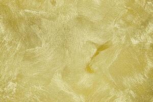 Texture of golden decorative plaster or concrete. Abstract gold grunge background. photo