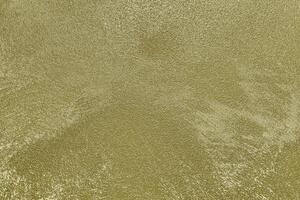 Texture of golden decorative plaster or concrete. Abstract gold grunge background. photo