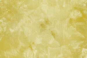 Texture of golden decorative plaster or concrete. Abstract gold grunge background. photo