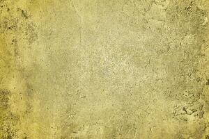 Texture of golden decorative plaster or concrete. Abstract gold grunge background. photo