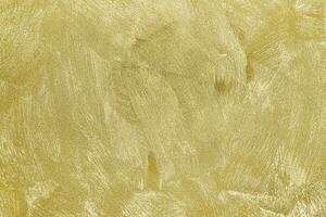 Texture of golden decorative plaster or concrete. Abstract gold grunge background. photo