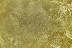 Texture of golden decorative plaster or concrete. Abstract gold grunge background. photo