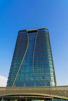 Uzbekistan, Tashkent - JUNE 17, 2023 Building of hotel Hilton on a blue sky background in Tashkent city district. photo