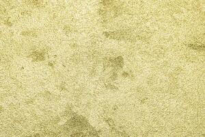 Texture of golden decorative plaster or concrete. Abstract gold grunge background. photo