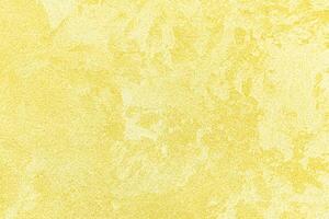 Texture of golden decorative plaster or concrete. Abstract gold grunge background. photo