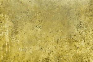 Texture of golden decorative plaster or concrete. Abstract gold grunge background. photo