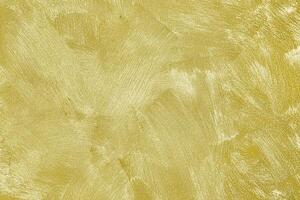 Texture of golden decorative plaster or concrete. Abstract gold grunge background. photo