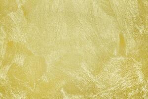 Texture of golden decorative plaster or concrete. Abstract gold grunge background. photo