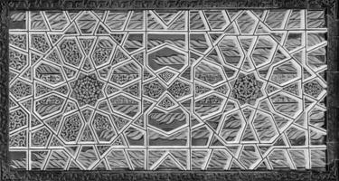 Geometric traditional Islamic ornament. Fragment of a ceramic mosaic. Black and white. photo