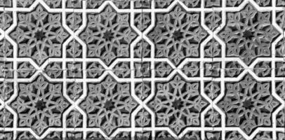 Geometric traditional Islamic ornament. Fragment of a ceramic mosaic. Black and white. photo