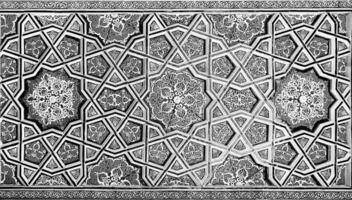 Geometric traditional Islamic ornament. Fragment of a ceramic mosaic. Black and white. photo