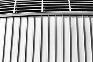 The texture of the cladding of the building from metal aluminum panels. Abstract background. photo