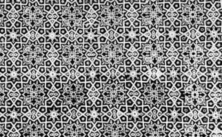 Geometric traditional Islamic ornament. Fragment of a ceramic mosaic. Black and white. photo