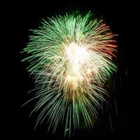 Colorful celebration fireworks isolated on a black sky background. photo