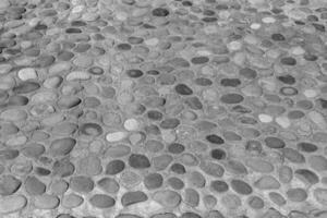 Old antique stone wall texture. Black and white. photo