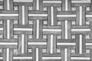 Black and white Texture of a decorative brick-like tiles. Abstract background for design. photo