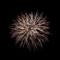 Colorful celebration fireworks isolated on a black sky background. photo