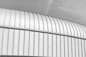 Black and white modern building covered with metal aluminum panels. photo