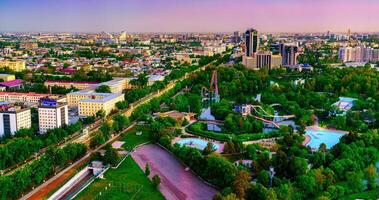 Uzbekistan, Tashkent - April 24, 2023 Top view from the observation deck on the Tashkent TV tower to the central part of the city during the twilight. photo