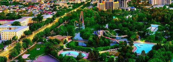 Uzbekistan, Tashkent - April 24, 2023 Top view from the observation deck on the Tashkent TV tower to the central part of the city during the twilight. photo