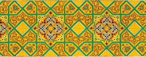 Geometric traditional Islamic ornament on a tile. Fragment of a ceramic mosaic.Abstract background. photo