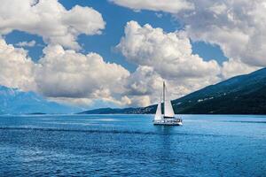 Sailing ship in the bay of the Adriatic Sea. Vacation on a sailboat. photo