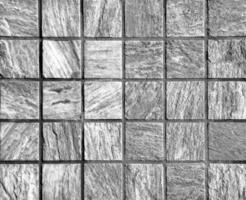 Black and white Texture of a decorative brick-like tiles. Abstract background for design. photo