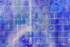 Colorful graffiti painted on a decorative brick like tiles. Abstract urban background. Spray painting art. photo