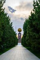 Monument to the Independence and Humanism in gold globe form at the Independence square, Tashkent. photo