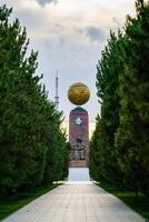 Monument to the Independence and Humanism in gold globe form at the Independence square, Tashkent. photo