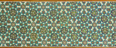 Geometric traditional Islamic ornament. Fragment of a ceramic mosaic. photo