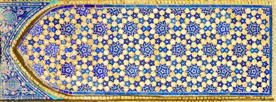 Geometric traditional Islamic ornament. Fragment of a ceramic mosaic. photo