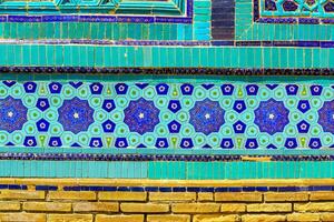 Geometric traditional Islamic ornament. Fragment of a ceramic mosaic. photo