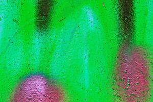 Colorful graffiti painted on a wall. Abstract urban background. Spray painting art. photo