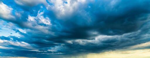 An approaching thunderstorm in a flowering rapeseed field. photo