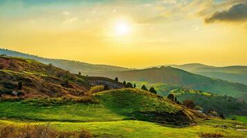 Foggy sunset or dawn in the mountains covered with grass and cloudy dramatic sky. photo