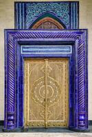 Carved wooden doors with patterns and mosaics. photo