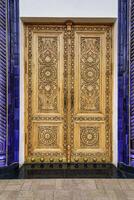 Carved wooden doors with patterns and mosaics. photo