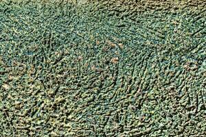 Texture of green scratched concrete. Abstract background. photo