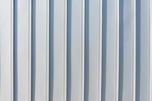 The texture of the cladding of the building from metal aluminum panels. Abstract background. photo