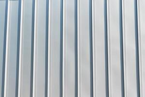 The texture of the cladding of the building from metal aluminum panels. Abstract background. photo