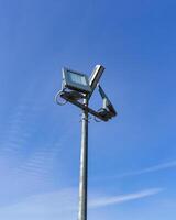 Modern LED lantern against the blue sky. photo