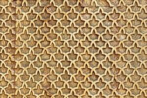 Fragment of an ancient carved wooden pattern. Ornate. Abstract background. photo