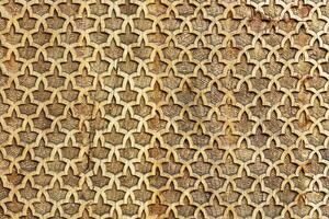 Fragment of an ancient carved wooden pattern. Ornate. Abstract background. photo