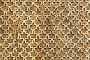 Fragment of an ancient carved wooden pattern. Ornate. Abstract background. photo