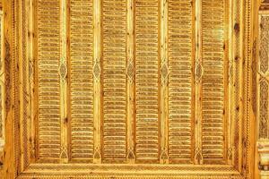 Fragment of an ancient carved wooden pattern. Ornate. Abstract background. photo