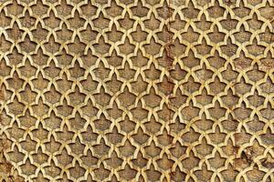 Fragment of an ancient carved wooden pattern. Ornate. Abstract background. photo