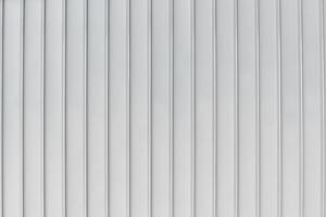 The texture of the cladding of the building from metal aluminum panels. Abstract background. photo