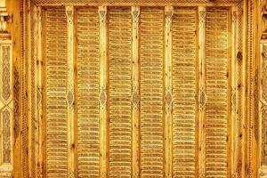 Fragment of an ancient carved wooden pattern. Ornate. Abstract background. photo